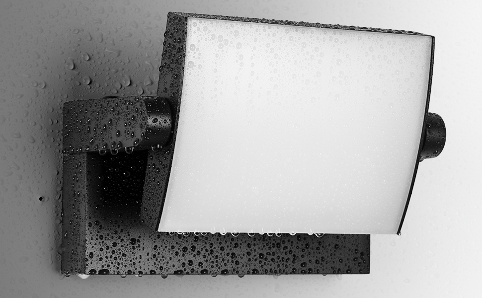 Rectangular device with a bright white screen or panel mounted on a dark, textured base. Water droplets are visible on the surface, suggesting water-resistant properties.