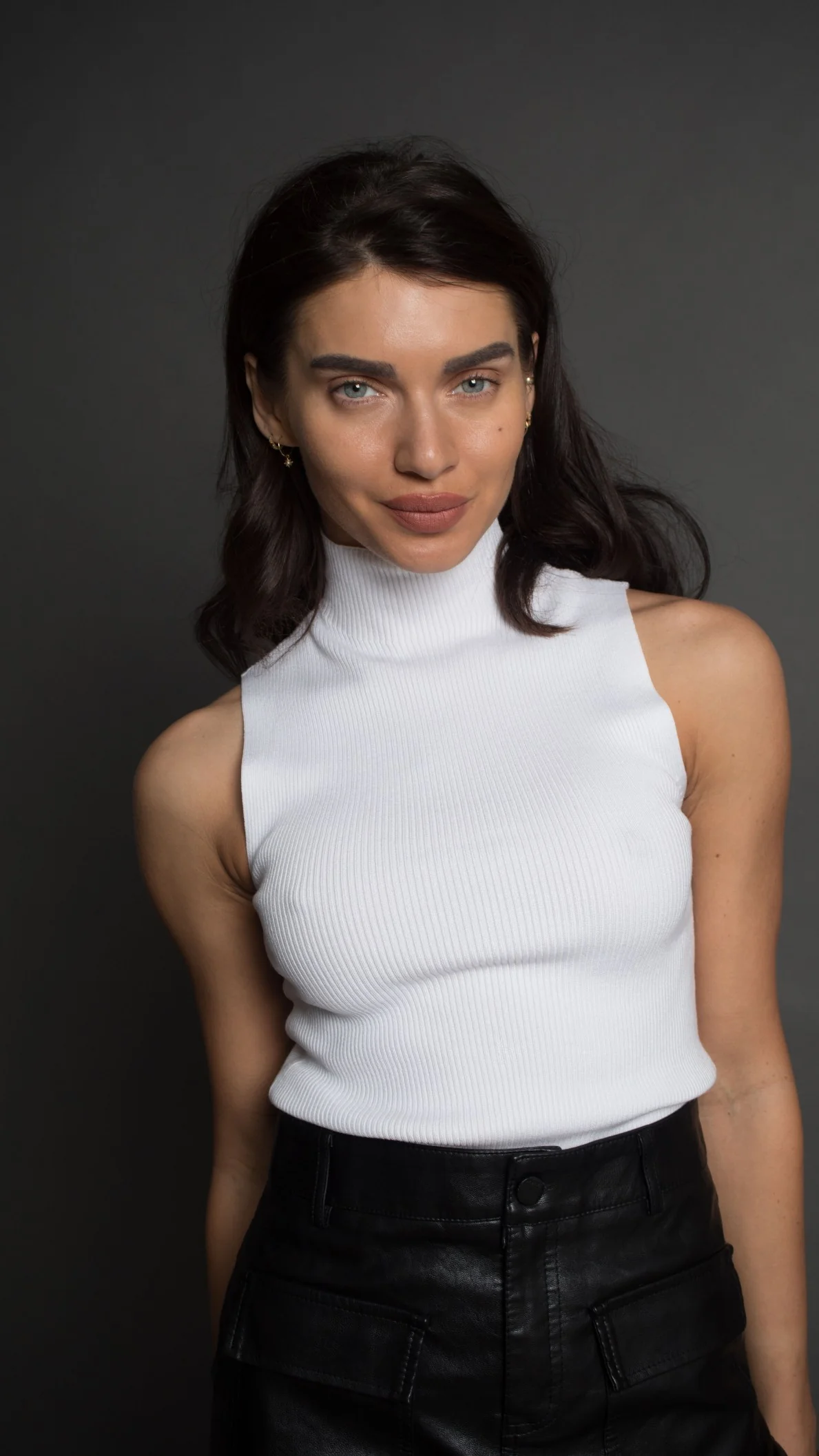 White sleeveless turtleneck