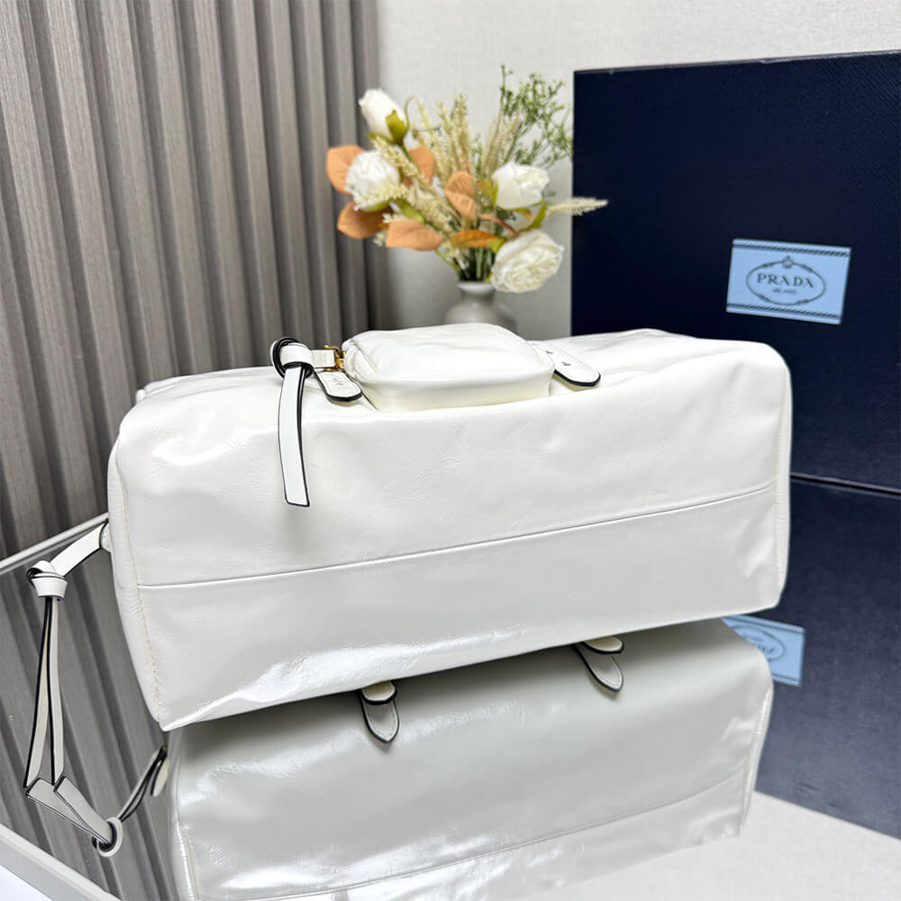 Prada Dangle medium leather top-handle bag - Replica Luxury Bags™