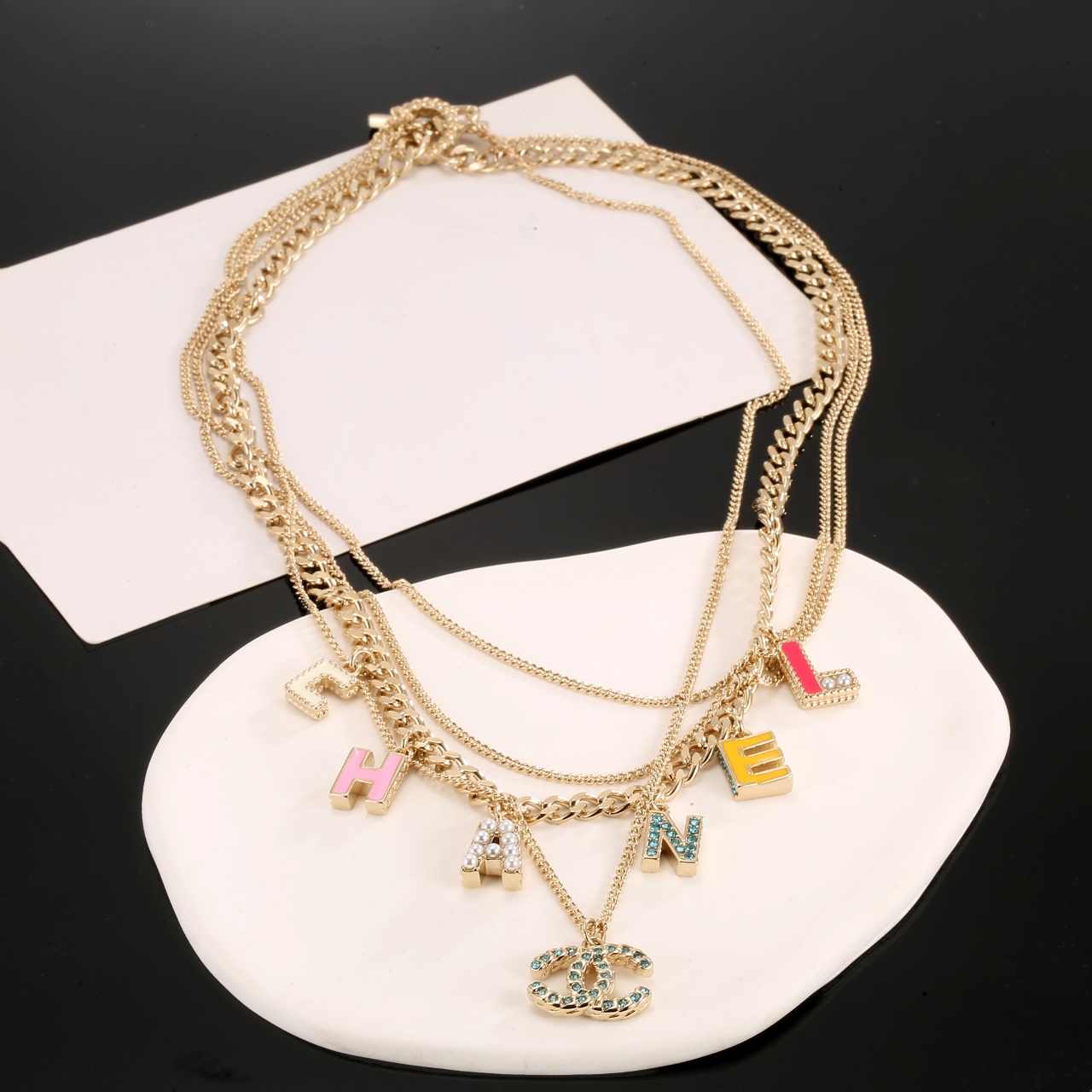 Chanel Multi Layered Light Gold Color Monogram Charms Necklace - Rep Fashion™