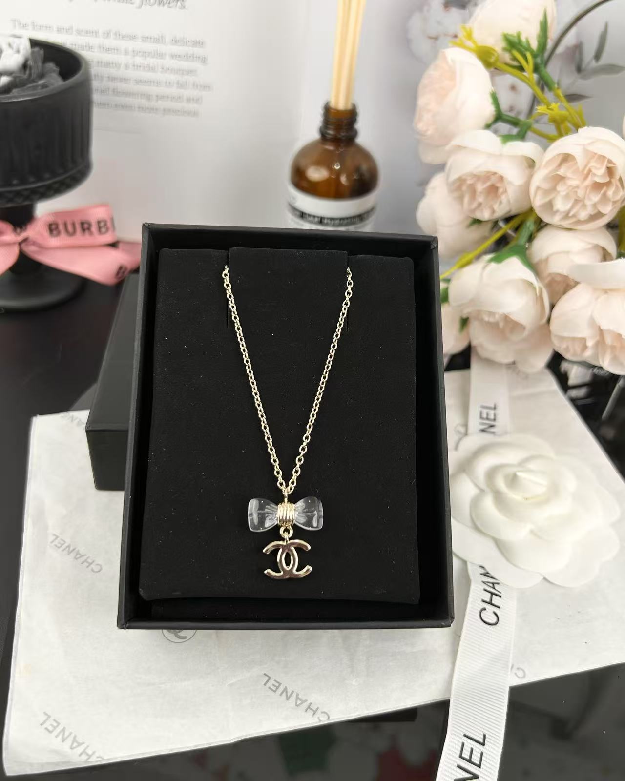 Chanel Transparent Bow CC Pendant Necklace - Rep Fashion™