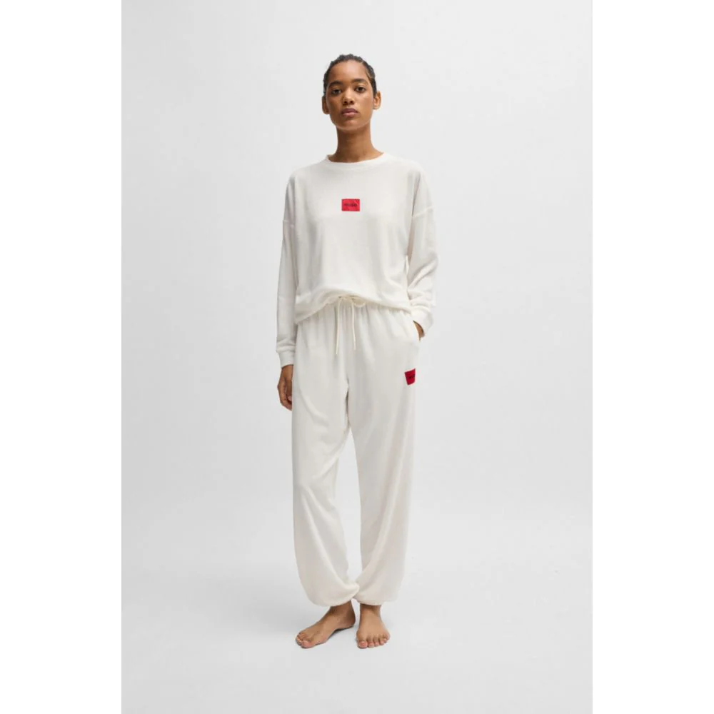 Tracksuit bottoms with red logo label