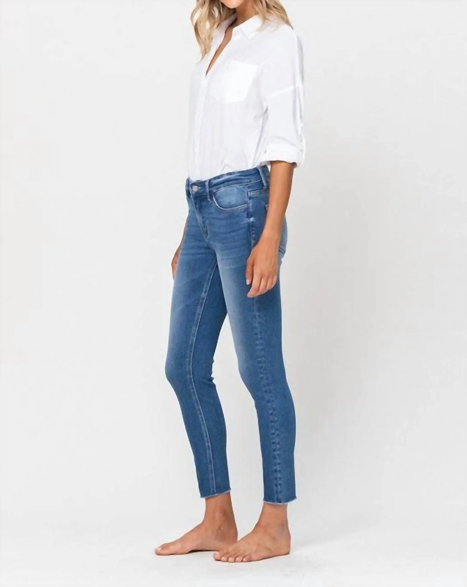 Simon Mid Rise Raw Hem Skinny Jean In Medium Wash