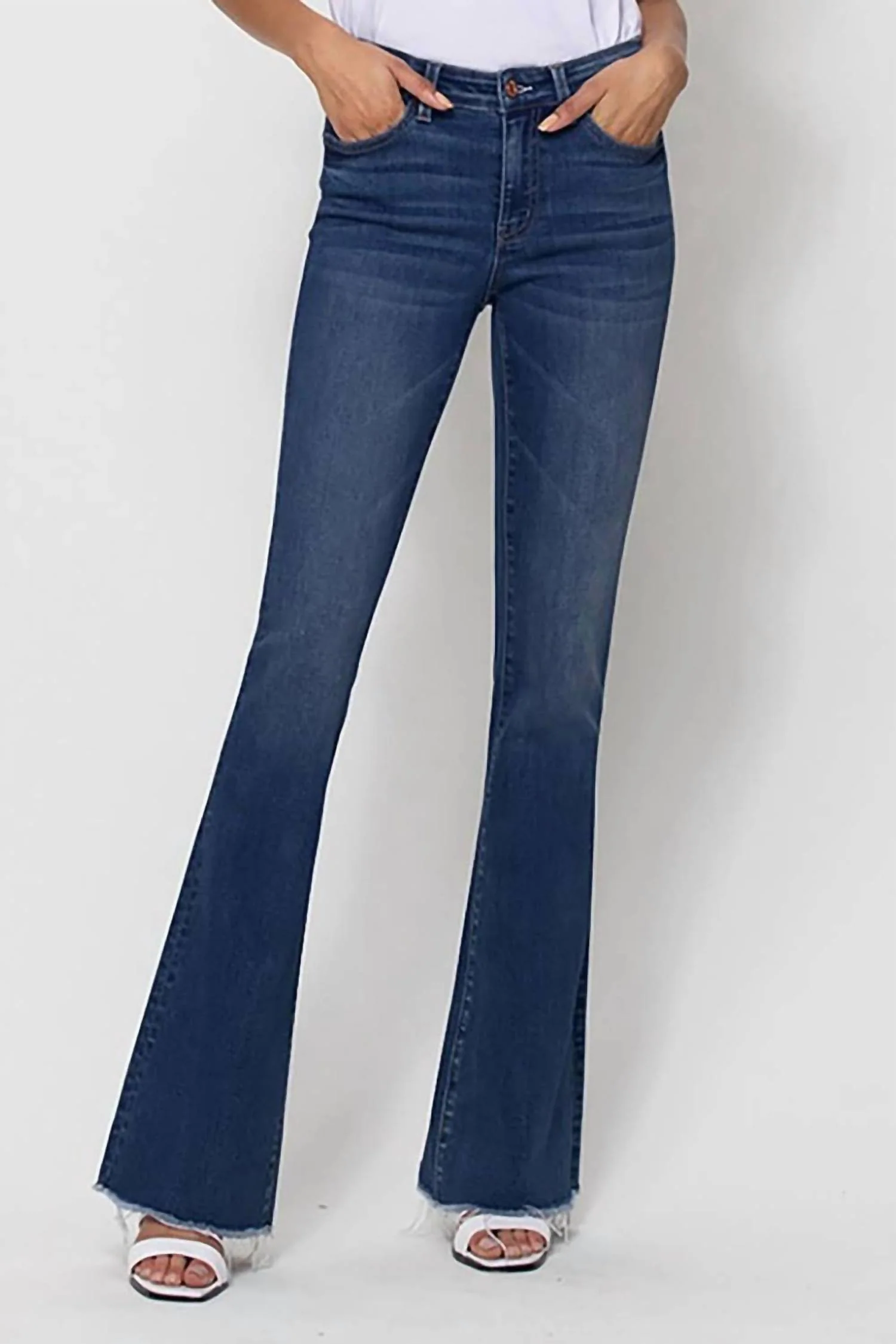 Mid Rise Raw Hem Flare Jeans In Witty