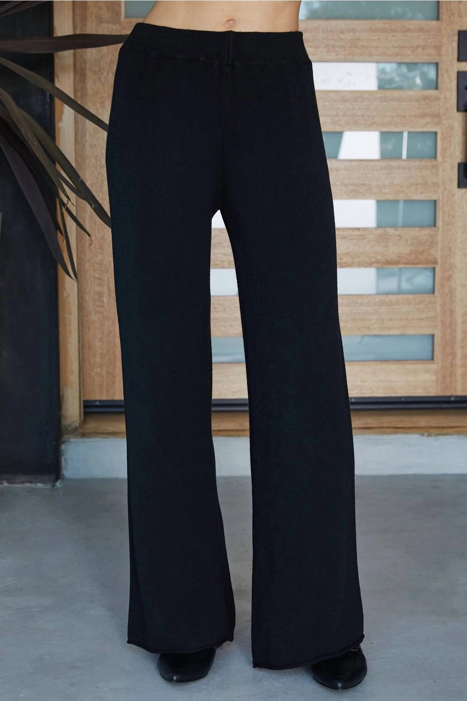 Italian Viscose Knit Flared Pants In Black